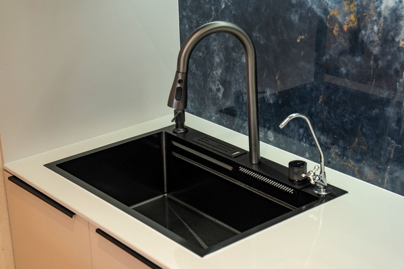 Modern kitchen sink and faucet installed during a Kitsap County kitchen remodel