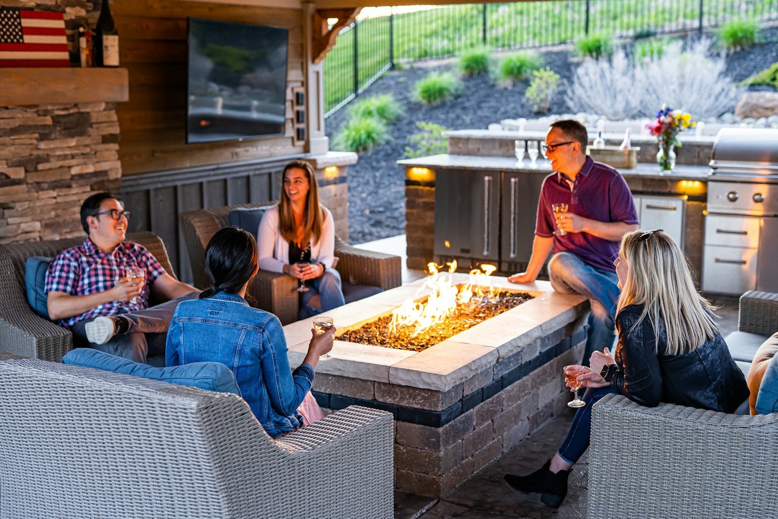 Natural gas fire pit table and built-in gas grill on a patio, the outdoor gas line installation Pelican Plumbing runs in Silverdale, WA